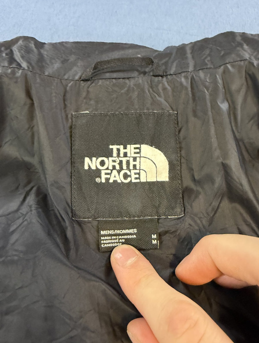 Zwarte jas van The North Face, maat M (gewatteerde tussenjas / puffer)