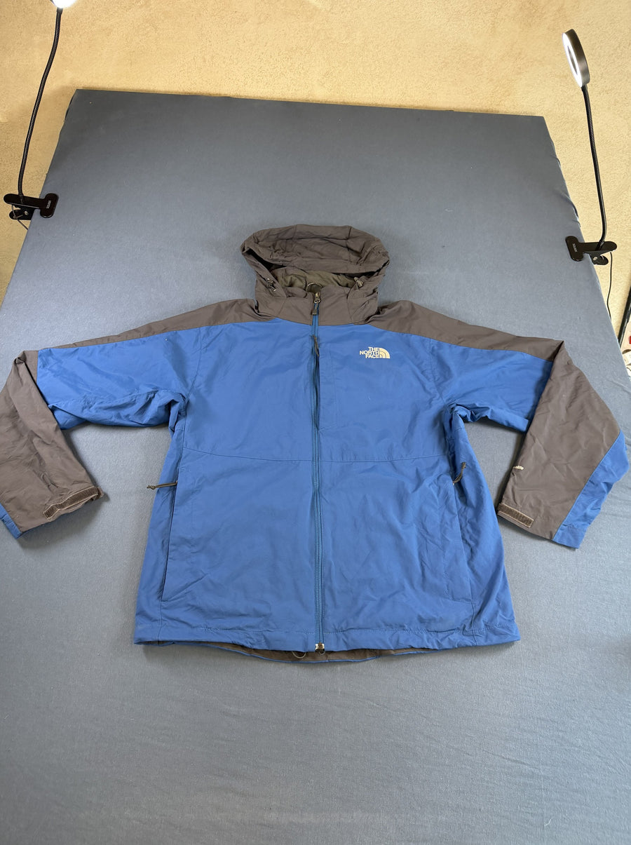Blauwe outdoorjas van The North Face - maat M (shelljack / regenjack)
