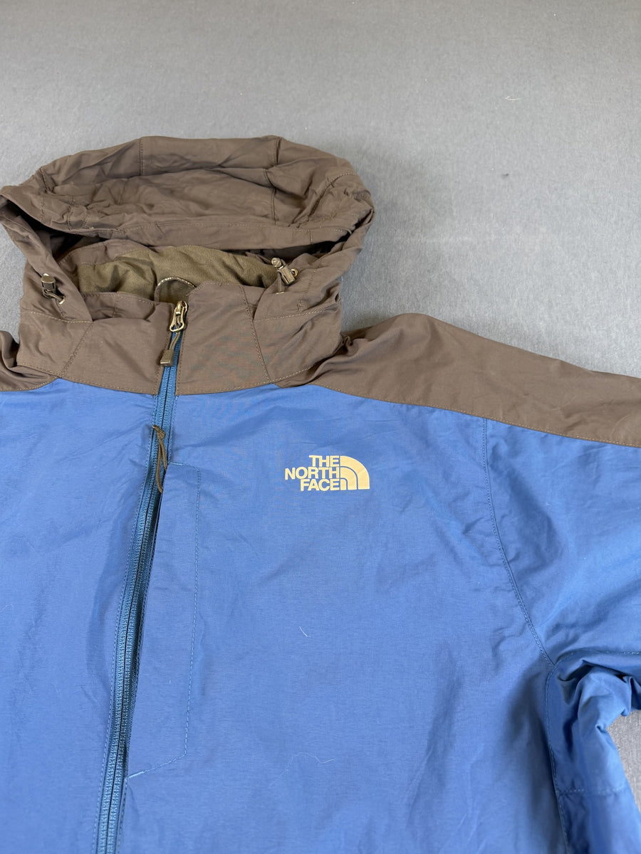 Blauwe outdoorjas van The North Face - maat M (shelljack / regenjack)